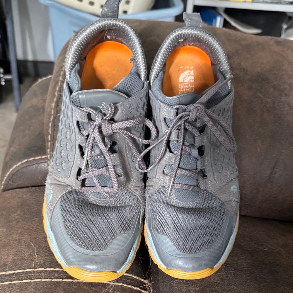 The North Face woman’s Charcoal and Mustard Athletic Shoes